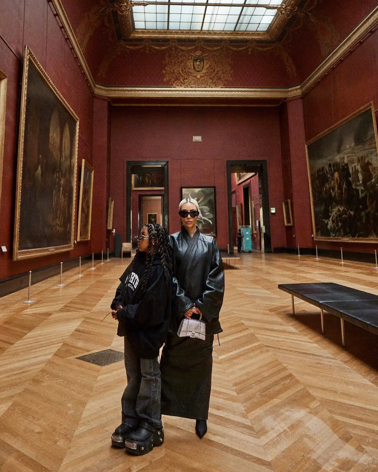 Posing in front of art