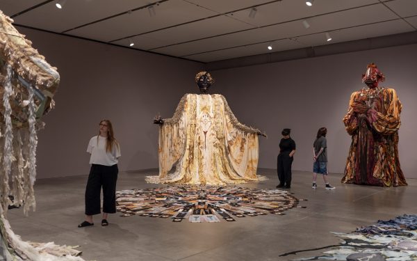 Tau Lewis Walks Amongst Giants