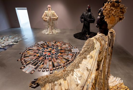 Tau Lewis Walks Amongst Giants